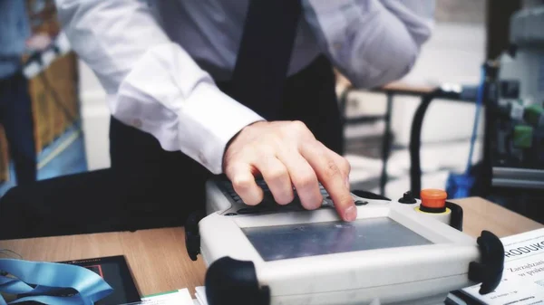 Robotics engineer uses industrial touchscreen computer — Stock Photo, Image