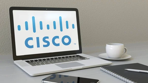 Portátil con el logotipo de Cisco Systems en la pantalla. Moderno lugar de trabajo editorial conceptual 3D rendering — Foto de Stock