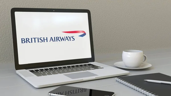 Laptop med British Airways-logotypen på skärmen. Moderna arbetsplatser konceptuella redaktionella 3d-rendering — Stockfoto