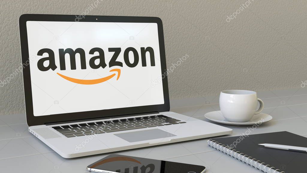 Laptop with Amazon.com logo on the screen. Modern workplace conceptual editorial 4K animation