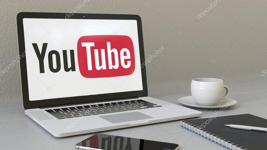 Laptop with YouTube logo on the screen. Modern workplace conceptual editorial 4K animation