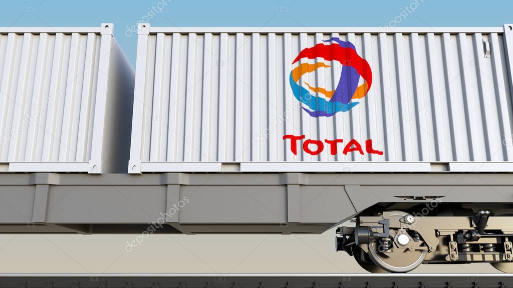 Railway transportation of containers with Total S.A. logo. Editorial 3D