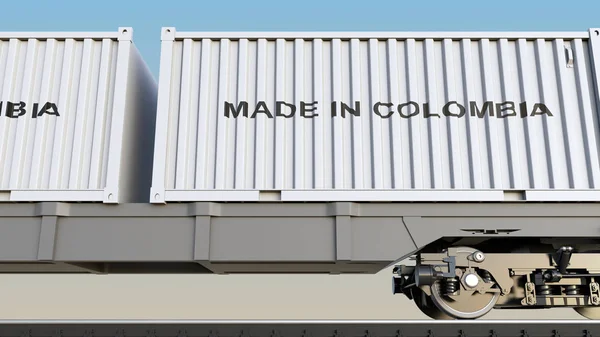 Грузовой поезд и контейнеры с надписью MADE IN COLOMBIA. Железнодорожный транспорт. 3D рендеринг — стоковое фото