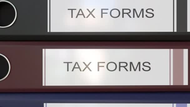 Montaje vertical de aglutinantes de oficina multicolor con etiquetas de formularios fiscales — Vídeos de Stock