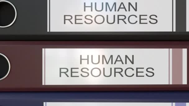 Montaje vertical de aglutinantes de oficina multicolor con etiquetas de recursos humanos — Vídeo de stock