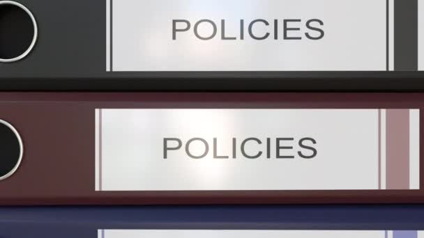 Empilement vertical de classeurs de bureau multicolores avec étiquettes Policies — Video