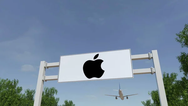 Avión volando sobre la cartelera publicitaria con el logotipo de Apple Inc.. Entrada moderna al edificio de oficinas. Representación Editorial 3D — Foto de Stock