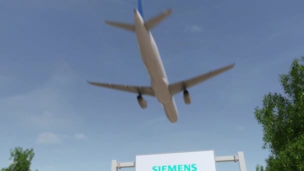 Avion survolant le panneau publicitaire avec le logo Siemens. Editorial 3D rendu clip 4K — Video