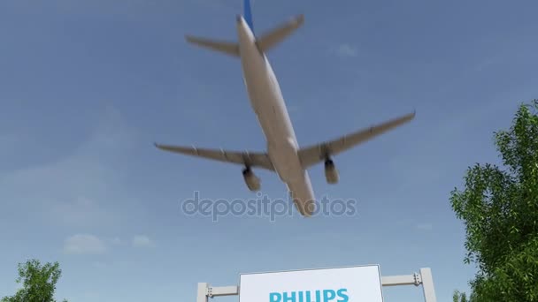 Aereo che sorvola il cartellone pubblicitario con logo Philips. Rendering 3D editoriale clip 4K — Video Stock