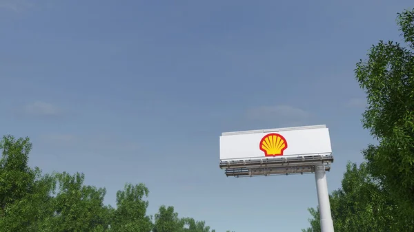 Doğru reklam billboard Shell petrol şirketi logosu ile sürüş. Editoryal 3d render — Stok fotoğraf