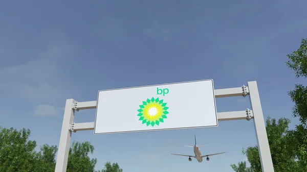 Самолет пролетает над рекламным щитом с логотипом BP. Редакционная 3D рендеринг — стоковое фото