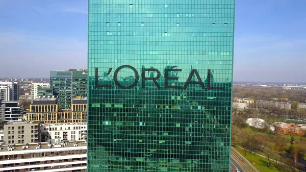 Aerial shot of office skyscraper with LOreal logo. Modern office building. Editorial 3D rendering — Stock Photo, Image