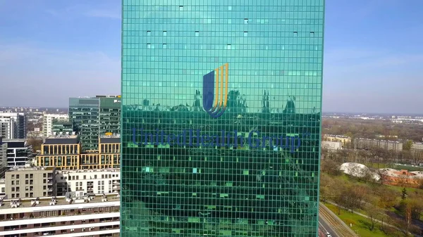 Aerial shot of office skyscraper with UnitedHealth Group logo. Modern office building. Editorial 3D rendering — Stock Photo, Image