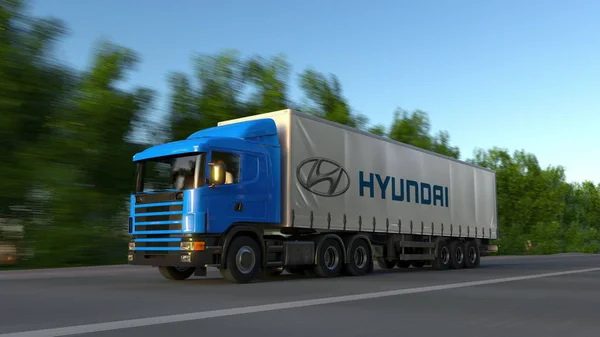 Ciężarówki naczepy towarowe z logo Hyundai Motor Company, jadąc wzdłuż dróg leśnych. Redakcji renderowania 3d — Zdjęcie stockowe