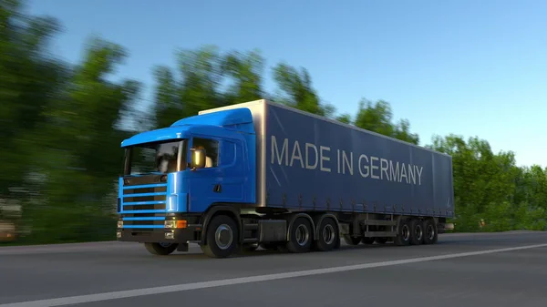 Rozpędzony samochód semi towarowych z napisem Made In Germany na przyczepie. Transport drogowy ładunków. renderowania 3D — Zdjęcie stockowe