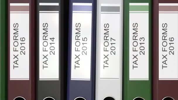 Múltiples carpetas de oficina con formularios fiscales etiquetas de texto 3D renderizado diferentes años — Vídeos de Stock