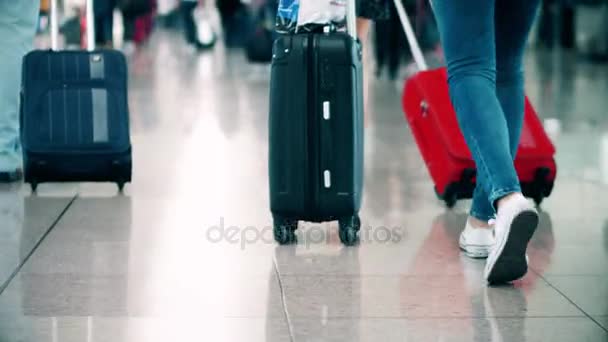 BARCELONA, SPAIN - APRIL, 15, 2017. Steadicam close-up shot of tourist feet and baggage at international airport terminal. 4K video — Stock Video