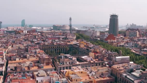 Barcelona rooftops and distant seaport, Spain. 4K pan shot — Stock Video