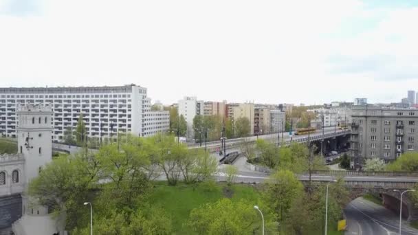 WARSAW, POLAND - MAY, 2, 2017. Aerial rising shot of city street and moving yellow tram. 4K video — Stock Video