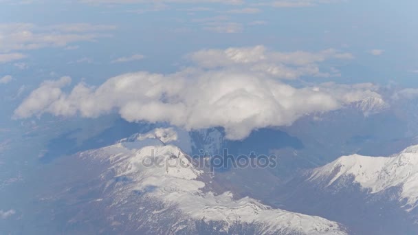 Beautiful cloud above the Alps snowy mountain peaks, aeial view. 4K stabilized shot — Stock Video