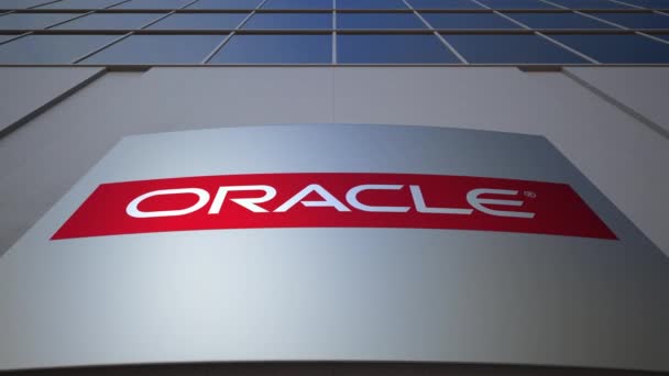 Panneau d'affichage extérieur avec logo Oracle Corporation. Immeuble de bureaux moderne. Editorial rendu 3D — Video