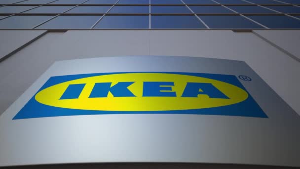 Наружная вывеска с логотипом Ikea. Современное офисное здание. Редакционная 3D рендеринг — стоковое видео