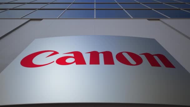 Oznakowania zewnętrznego deska z Canon Inc. logo. Nowoczesny biurowiec. Redakcji renderowania 3d — Wideo stockowe
