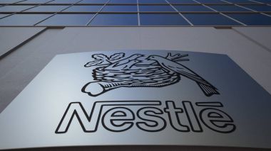 Outdoor signage board with Nestle logo. Modern office building. Editorial 3D rendering clipart