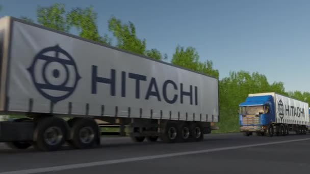 Árufuvarozási kamionok vezetés erdei út mentén, varrat nélküli hurok Hitachi logóval. Szerkesztői 4k klip — Stock videók