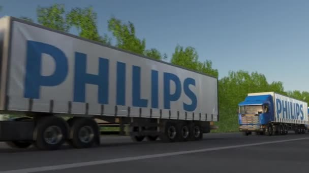 Fracht ciężarówki z logo firmy Philips jazdy wzdłuż dróg leśnych, Płynna pętla. Klip redakcji 4k — Wideo stockowe