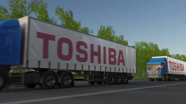 Vracht semi vrachtwagens met Toshiba Corporation logo rijden langs bos weg. Redactioneel 3D-rendering — Stockfoto