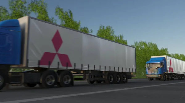 Camiones semirremolques de carga con el logotipo de Mitsubishi conduciendo a lo largo del camino forestal. Representación Editorial 3D —  Fotos de Stock