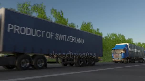 Moving freight semi trucks with PRODUCT OF SWITZERLAND caption on the trailer — Stock Video