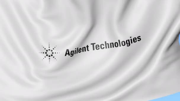 Размахивание флагом с логотипом Agilent Technologies. Seamles loop 4K editionary animation — стоковое видео