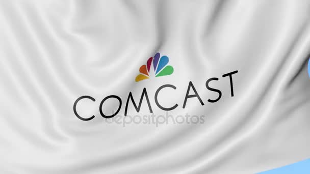 Drapeau ondulé avec logo Comcast. Seamles boucle 4K animation éditoriale — Video