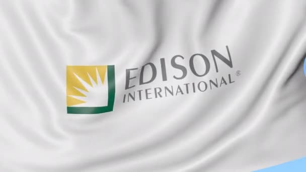 Розмахував прапором Едісон Міжнародний логотип. Seamles петлі 4 к редакційної анімації — стокове відео