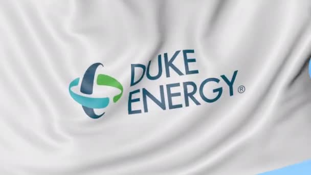 Mengayunkan bendera dengan logo Duke Energy. Animasi editorial Seamles loop 4K — Stok Video
