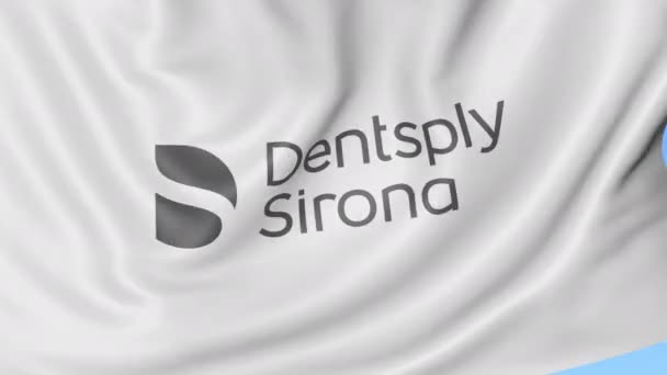 Размахиваю флагом с логотипом Dentsply Sirona. Seamles loop 4K editionary animation — стоковое видео