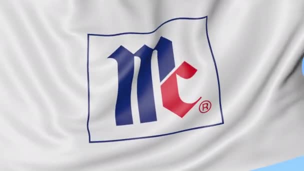 Mengayunkan bendera dengan logo Mccormick Company. Animasi editorial Seamles loop 4K — Stok Video