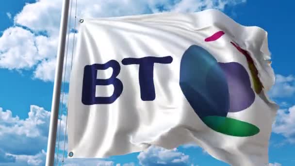 Waving flag with British Telecom BT logo against moving clouds. 4K editorial animation — Stock Video