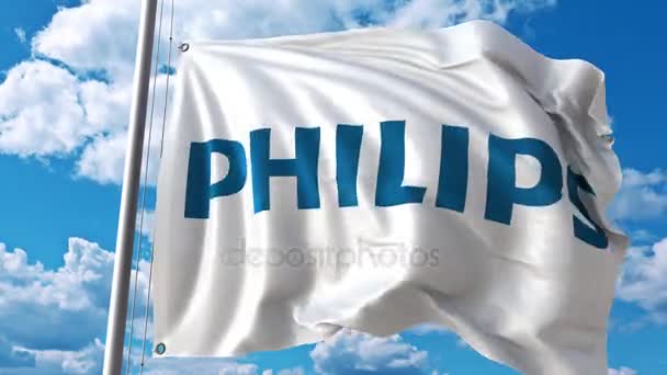 Bulutlar hareket karşı Philips logolu bayrak sallıyor. 4 k editoryal animasyon — Stok video