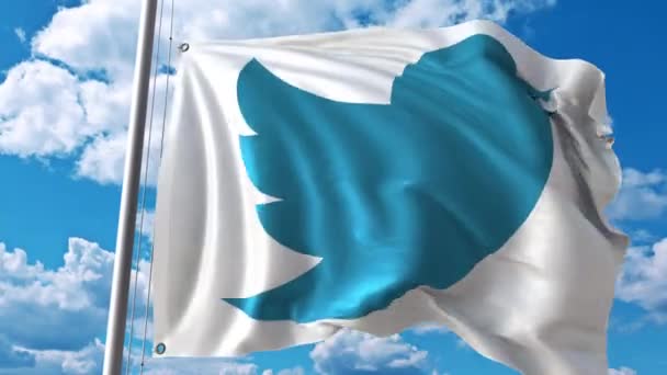 Bandera ondeando con el logotipo de Twitter contra nubes en movimiento. Animación editorial 4K — Vídeo de stock