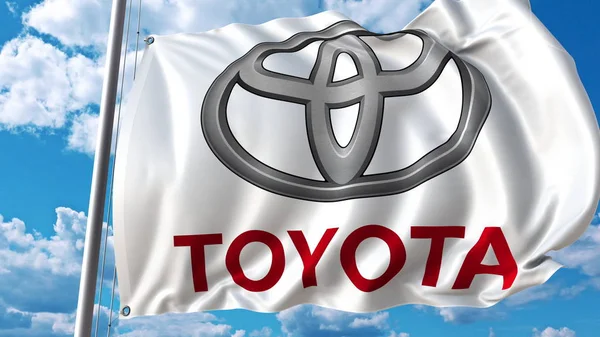 Bandera ondeando con el logotipo de Toyota contra cielo y nubes. Representación Editorial 3D — Foto de Stock