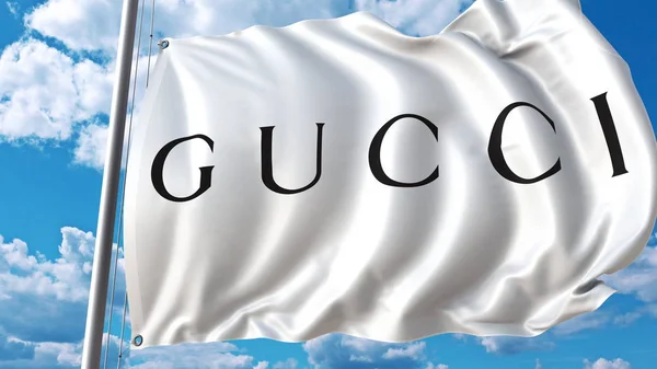 Drapeau agitant le logo Gucci contre le ciel et les nuages. Editorial rendu 3D — Photo