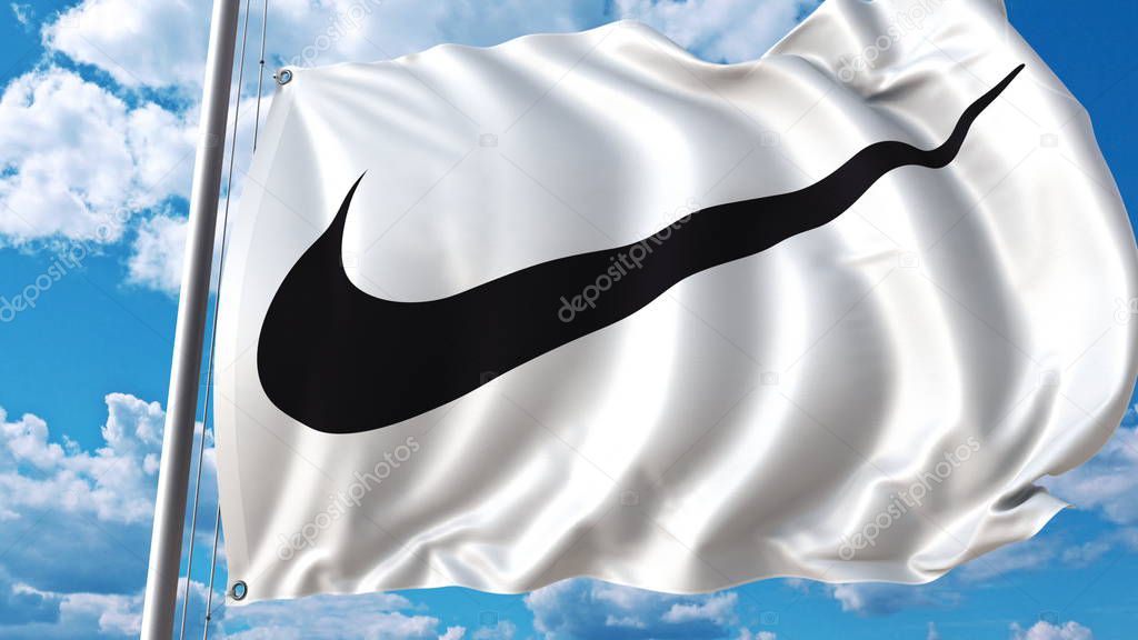 Waving flag with Nike logo against sky and clouds. Editorial 3D