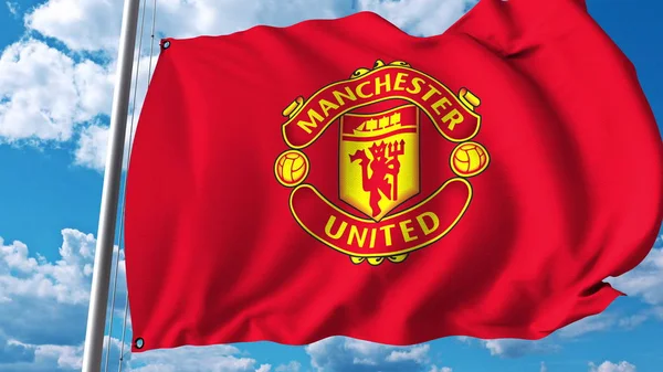 Flagge mit dem Logo der Fußballmannschaft von Manchester United schwenkend. redaktionelles 3D-Rendering — Stockfoto