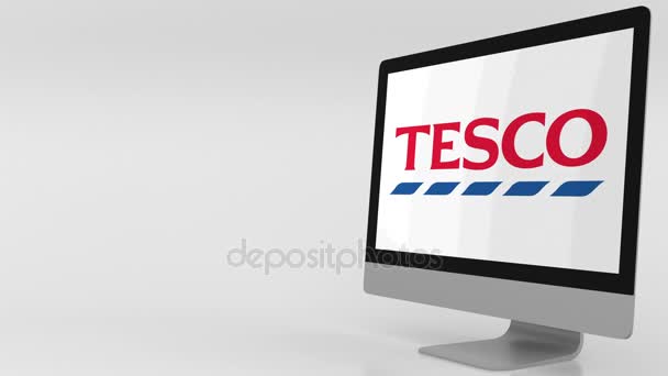 Écran d'ordinateur moderne avec logo Tesco. Clip éditorial 4K — Video
