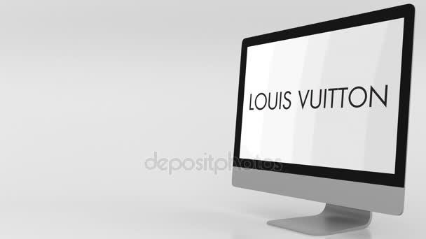 Moderne dataskjerm med Louis Vuitton-logo. 4K redaksjonell klipp – stockvideo