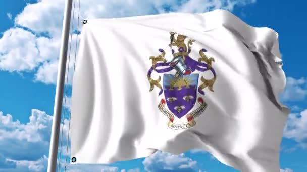 Viftande flagga med University of Manchester emblem. 4 k redaktionella klipp — Stockvideo