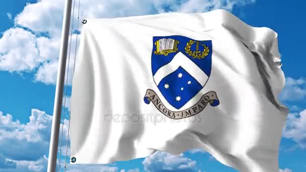 Monash Üniversitesi amblemi ile bayrak sallıyor. 4 k editoryal klip — Stok video